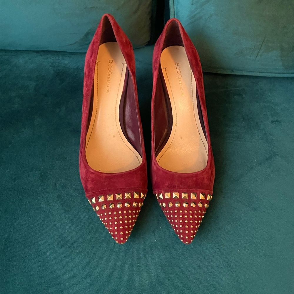 Really unique studded pointy- toes pumps. Burgundy suede with gold studs. 9.5